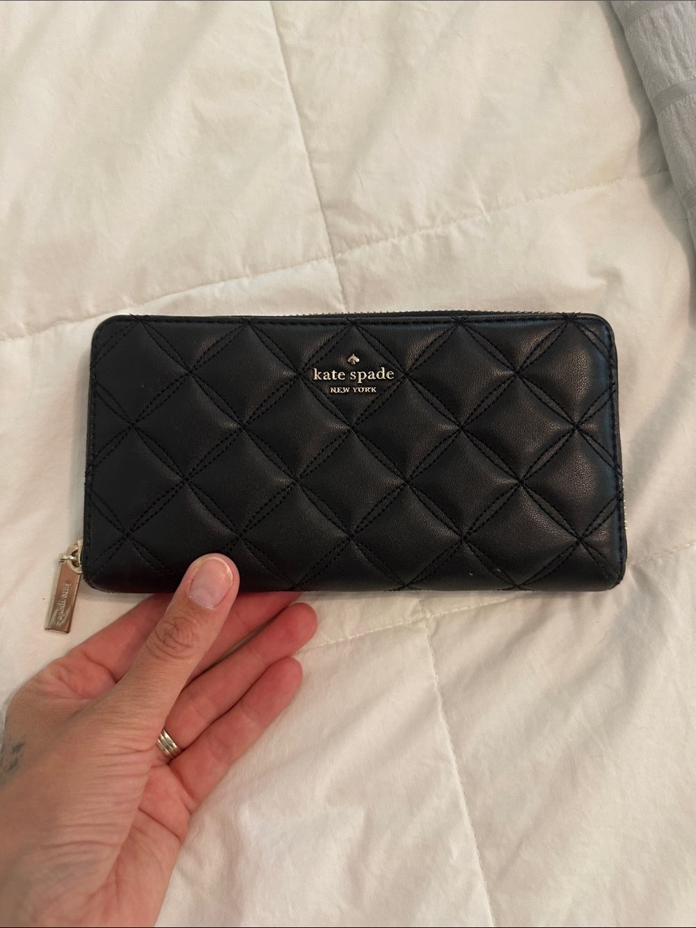 kate spade Black Quilted Leather Zip-Around Wallet with Gold Logo